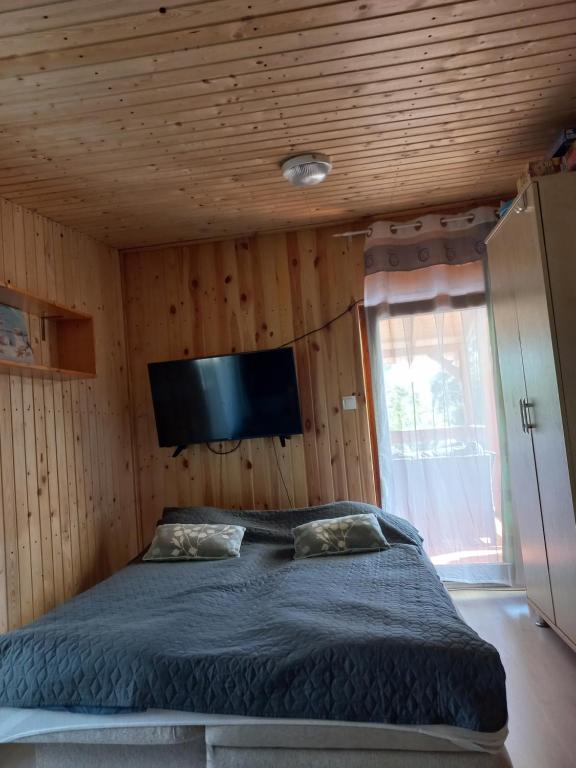 Voodi või voodid majutusasutuse Onix- Kis-tó Apartman ORFŰ toas
