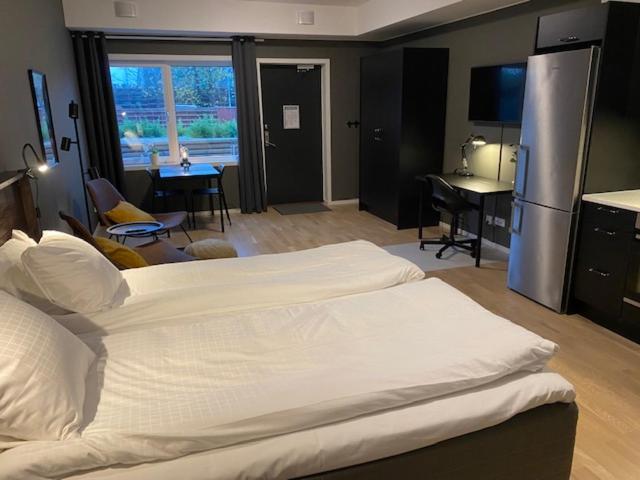 Postel nebo postele na pokoji v ubytování Magnolia House Norrviken