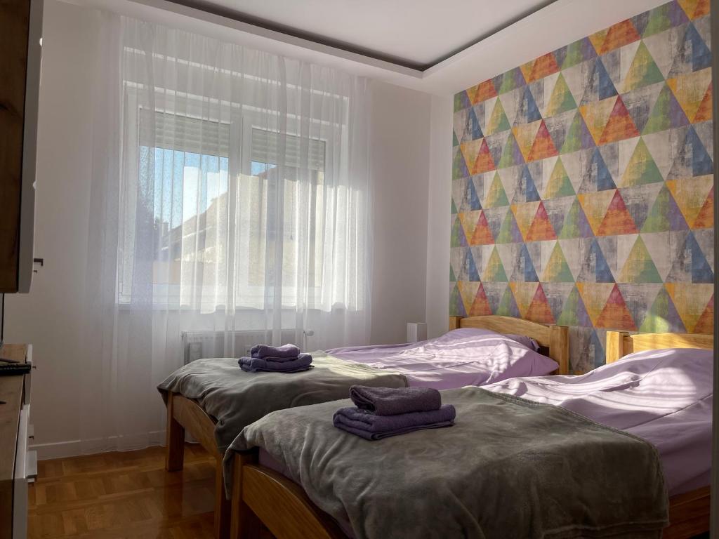 Postel nebo postele na pokoji v ubytování Apartman MDB