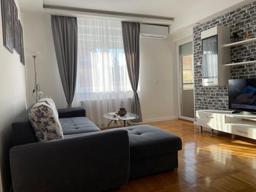 TV a/nebo společenská místnost v ubytování Apartman MDB