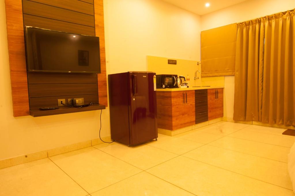 Kuchyň nebo kuchyňský kout v ubytování MC Suites Mysuru