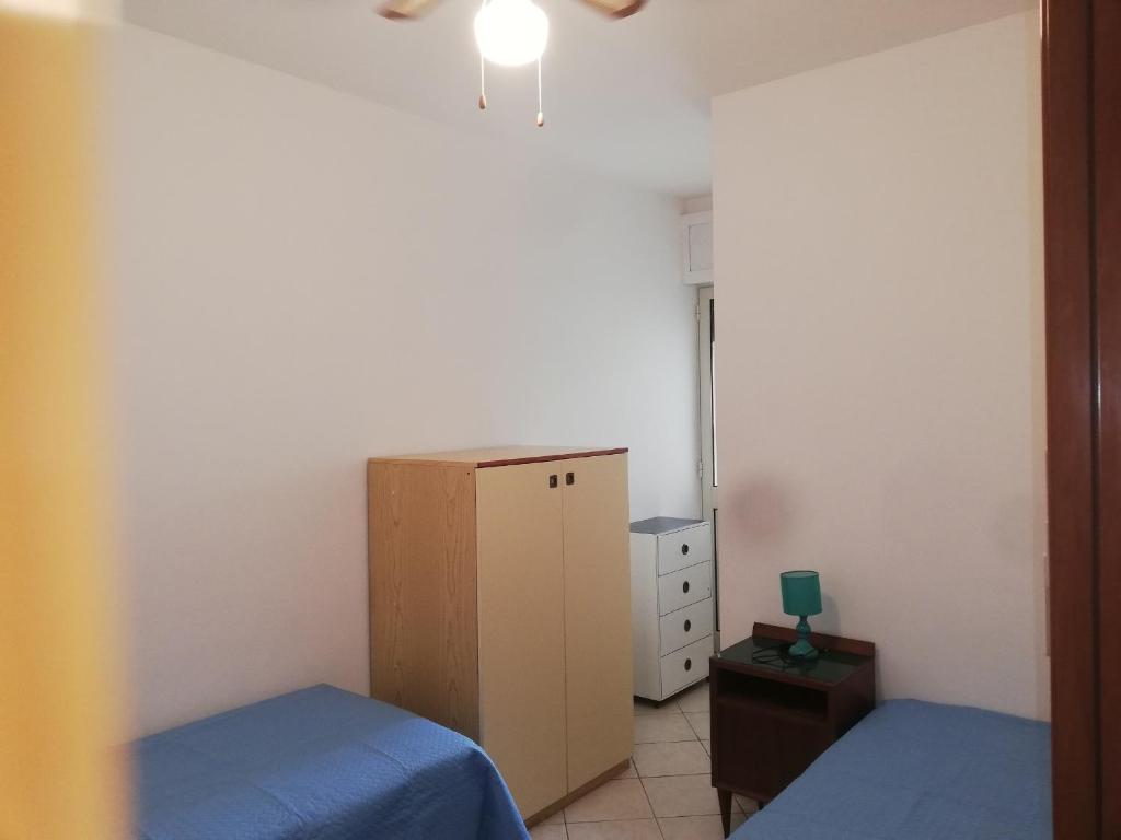 Łóżko lub łóżka w pokoju w obiekcie Rif. 086 e 087 Maldive di SalentoINvacanza.Com