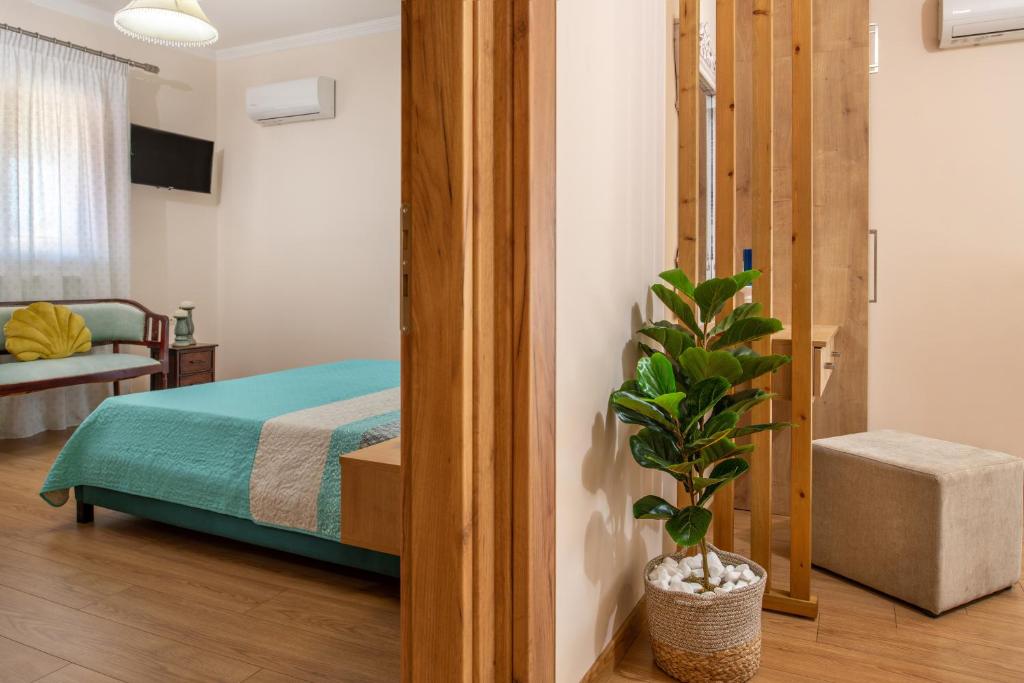 Postel nebo postele na pokoji v ubytování Diogenis House