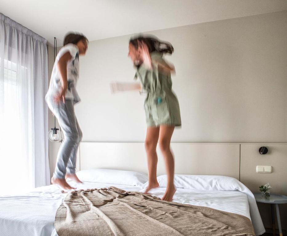 Postel nebo postele na pokoji v ubytování Apartamentos Dena