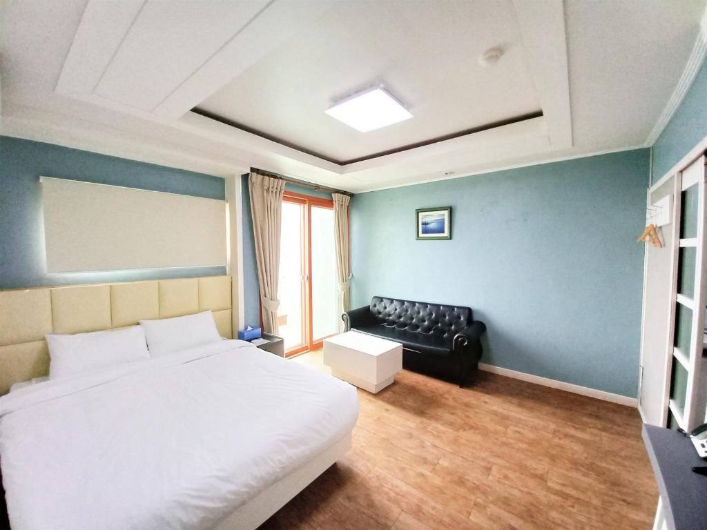 Postel nebo postele na pokoji v ubytování Dawoo Resortel