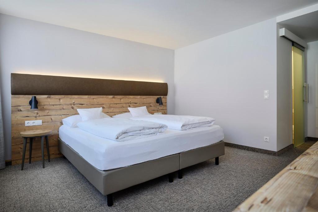 Postel nebo postele na pokoji v ubytování ApartHotel Rose