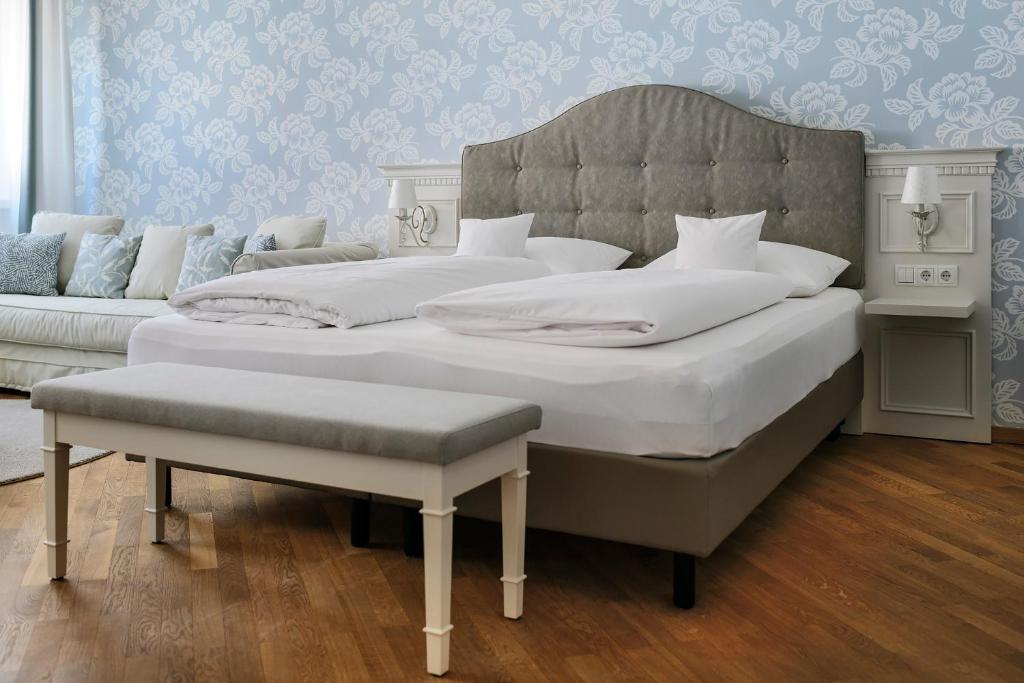 Postel nebo postele na pokoji v ubytování ApartHotel Rose
