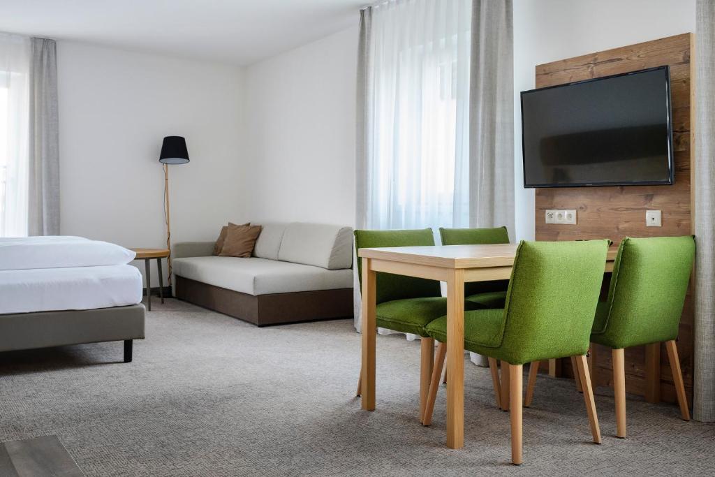 Postel nebo postele na pokoji v ubytování ApartHotel Rose