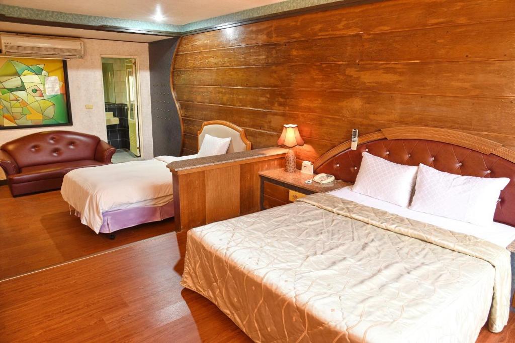Postel nebo postele na pokoji v ubytování Love Boat Motel
