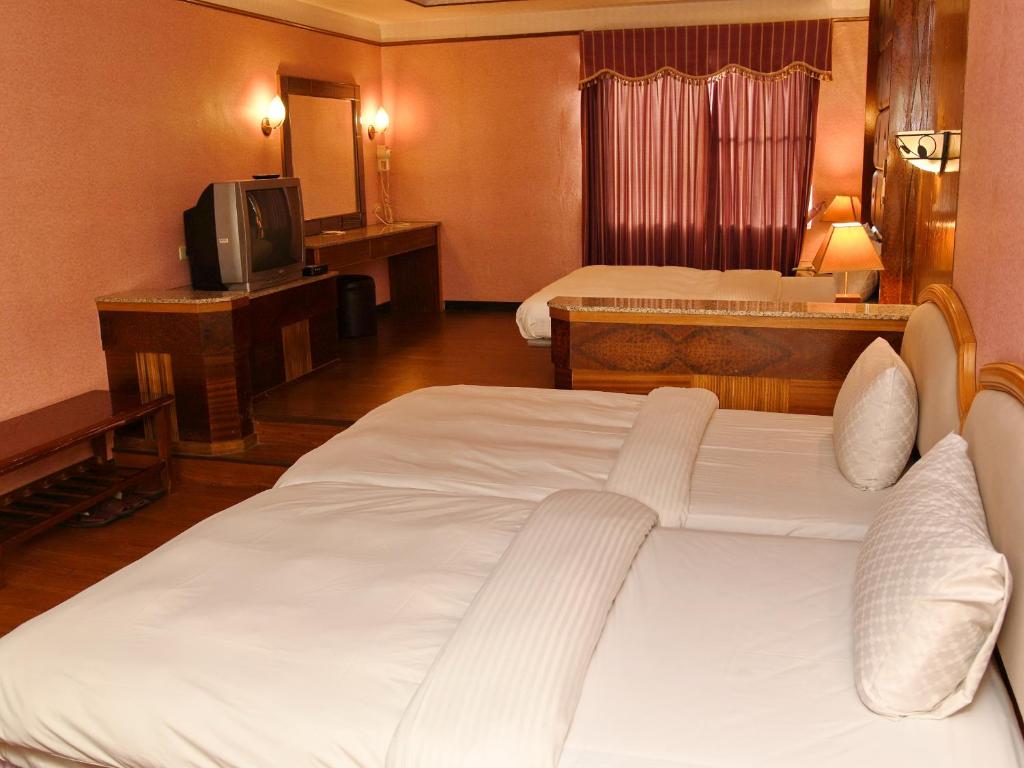 Postel nebo postele na pokoji v ubytování Love Boat Motel
