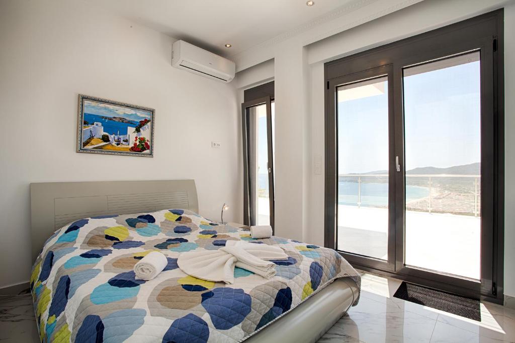 Posteľ alebo postele v izbe v ubytovaní Villa White Pearl