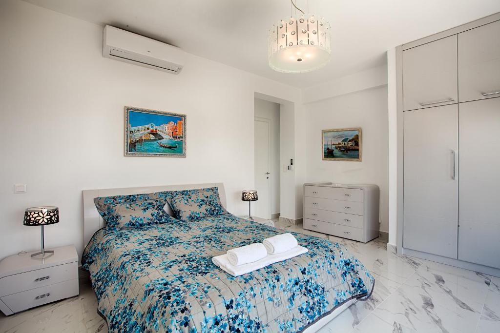Posteľ alebo postele v izbe v ubytovaní Villa White Pearl