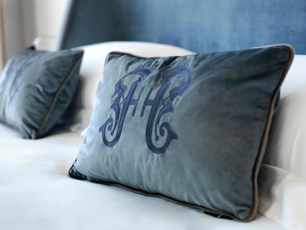 a pillow with a football on it on a bed at Limassol Del Mar in Limassol