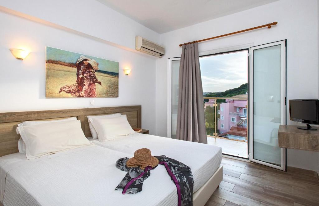 Postel nebo postele na pokoji v ubytování CORFU PELAGOS HOTEL