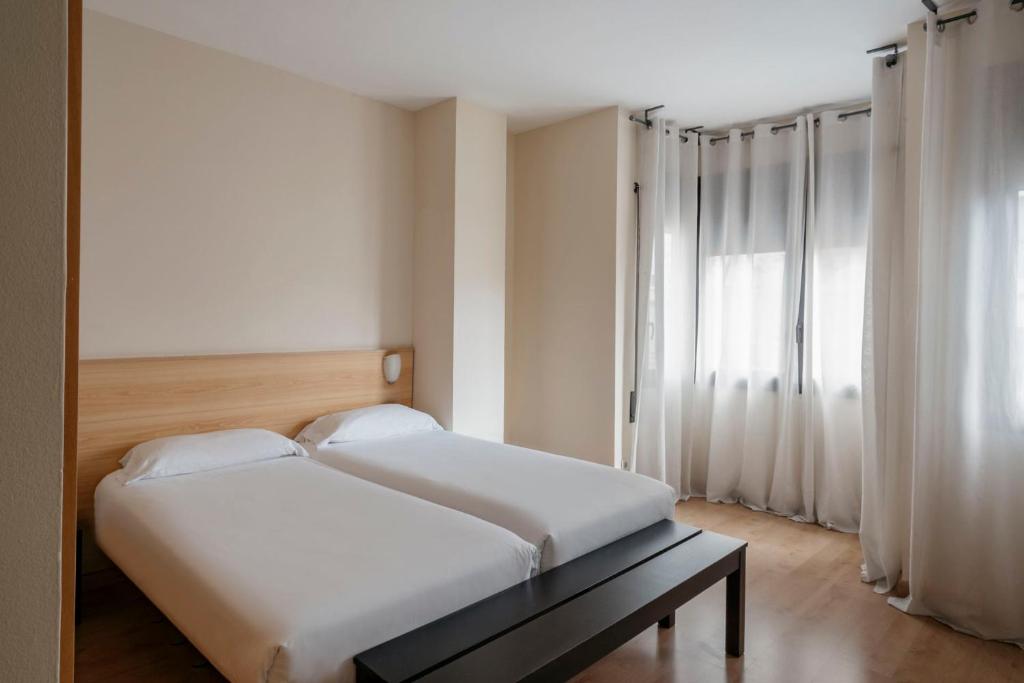 Postel nebo postele na pokoji v ubytování Barcelona Apartment Villarroel