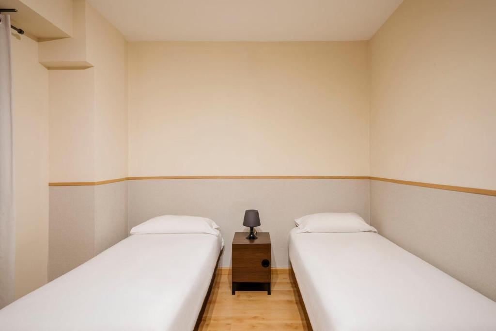 Postel nebo postele na pokoji v ubytování Barcelona Apartment Villarroel
