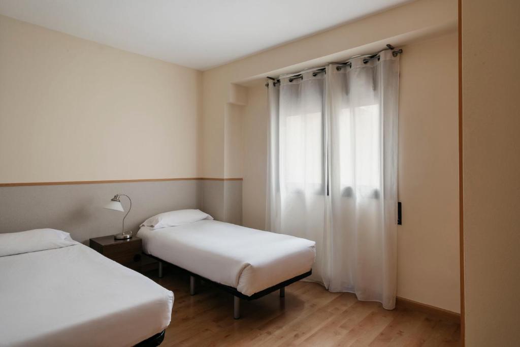 Postel nebo postele na pokoji v ubytování Barcelona Apartment Villarroel