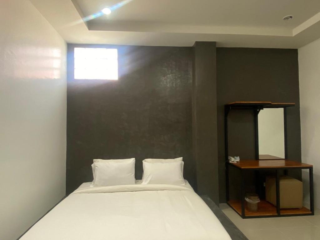 Postel nebo postele na pokoji v ubytování 22 Twenty-Two Hotel ทะเวนตี้-ทู โฮเทล