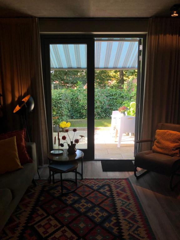 Posezení v ubytování Luxe B&B "In de Schulp", ontspan en geniet van comfort en stijl