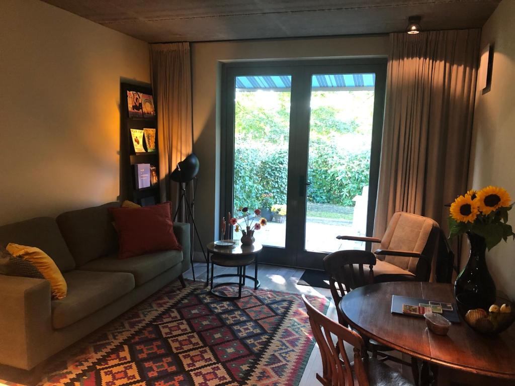 Posezení v ubytování Luxe B&B "In de Schulp", ontspan en geniet van comfort en stijl