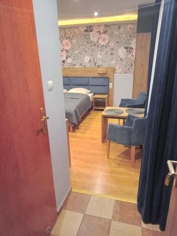 Postel nebo postele na pokoji v ubytování Gościniec Pod Polną Różą