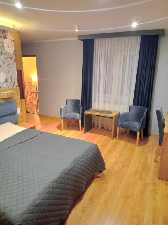 Postel nebo postele na pokoji v ubytování Gościniec Pod Polną Różą
