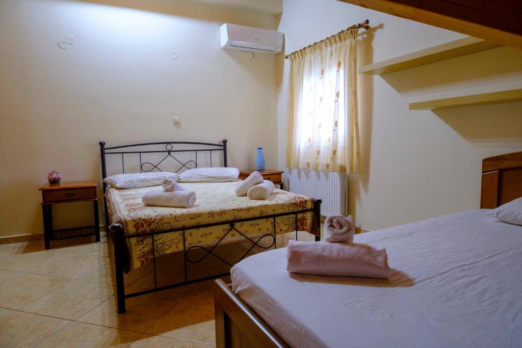 Łóżko lub łóżka w pokoju w obiekcie Simona's Loft
