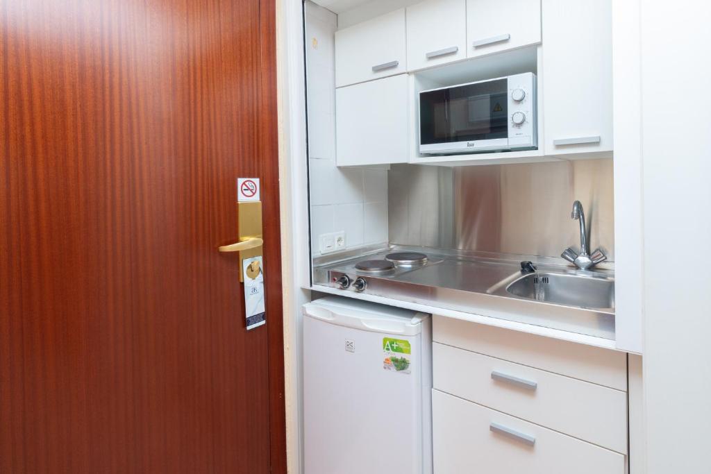 A cozinha ou cozinha compacta de Aparto Residence Galetamar