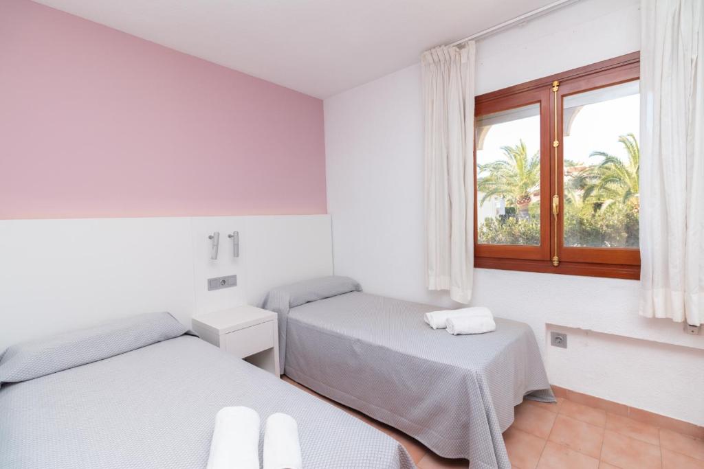 Cama ou camas em um quarto em Aparto Residence Galetamar