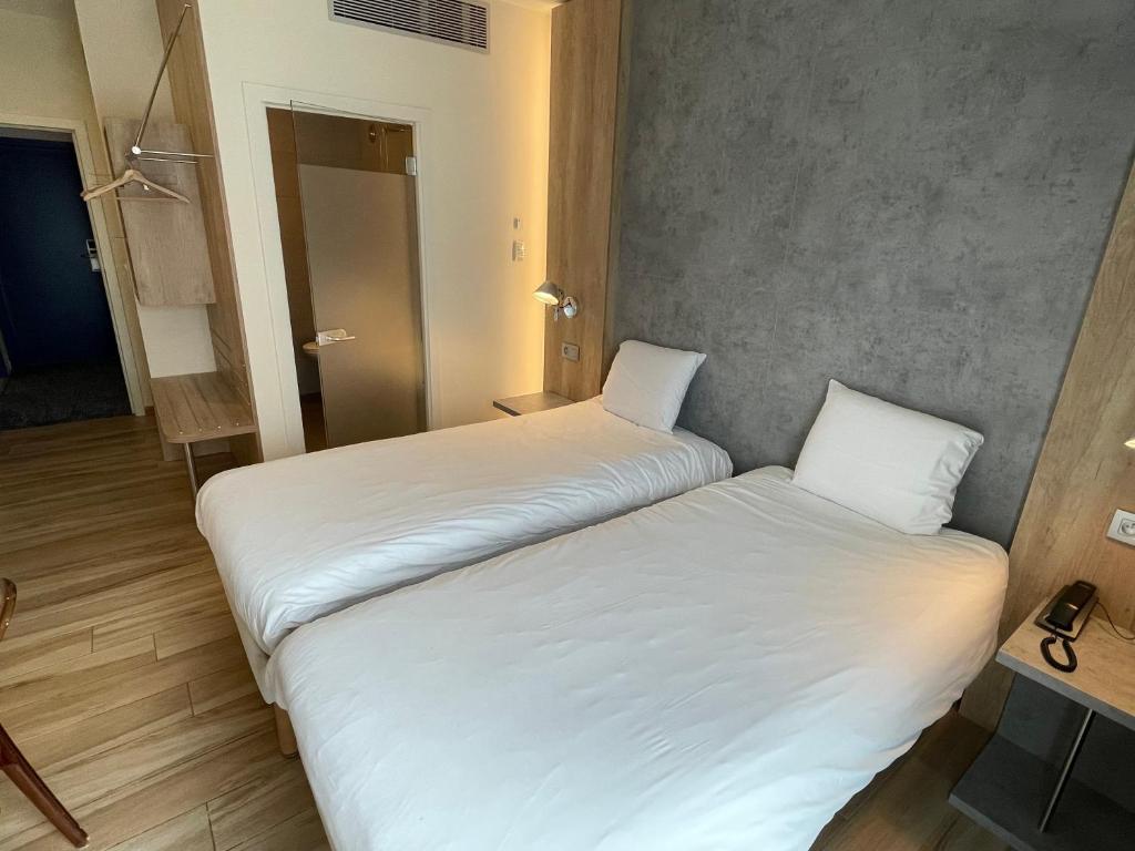 Postel nebo postele na pokoji v ubytování Ibis Styles La Louvière