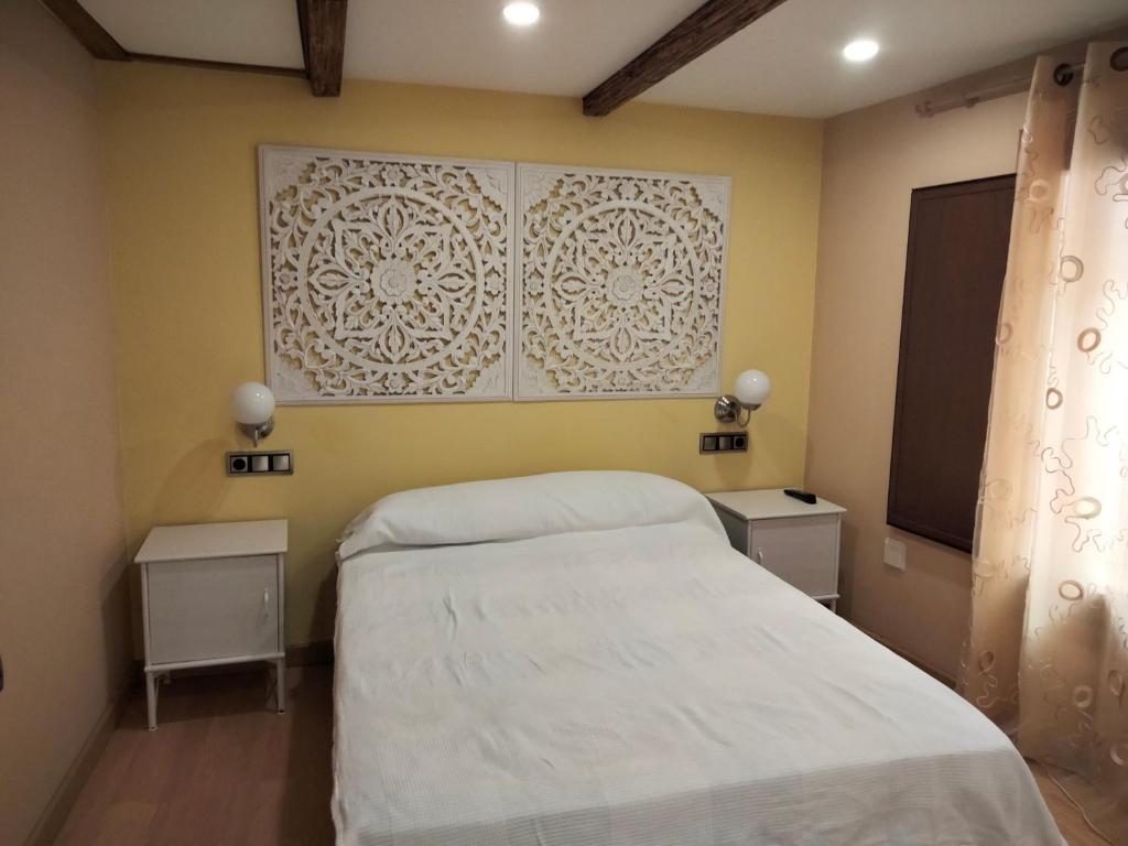 A bed or beds in a room at Casa al lado del mar