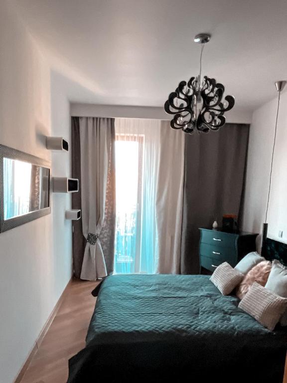 Posteľ alebo postele v izbe v ubytovaní Apartament Solna 80 - Centrum Miasta z podziemnym garażem