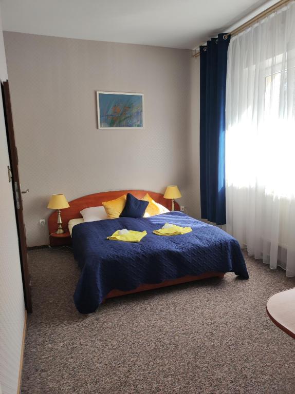 Posteľ alebo postele v izbe v ubytovaní Hotel Sudety