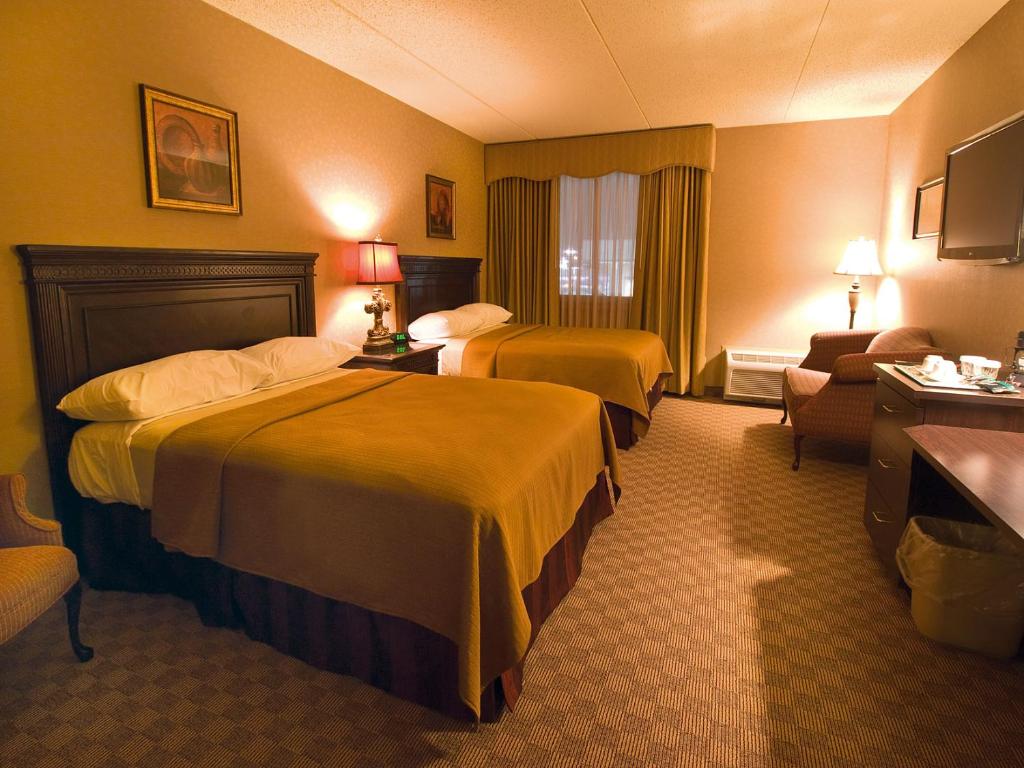 Postel nebo postele na pokoji v ubytování Salvatores Grand Hotel