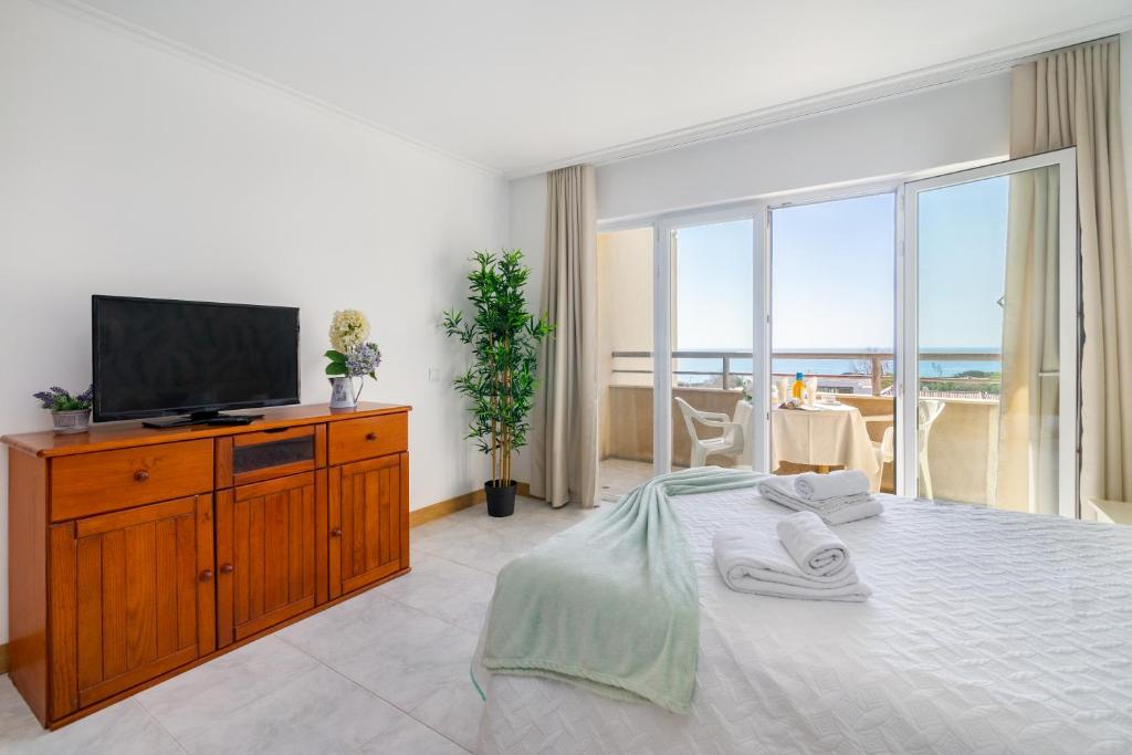 Ένα ή περισσότερα κρεβάτια σε δωμάτιο στο DreamStudio with SeaView by Encantos do Algarve - 7H
