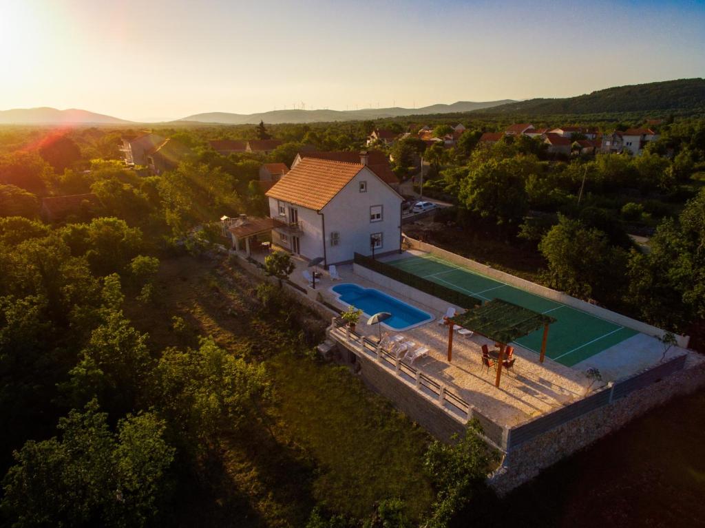 an aerial view of a house with a swimming pool at Luxury Villa Paloma Blanca with Heated Pool in Lovreć
