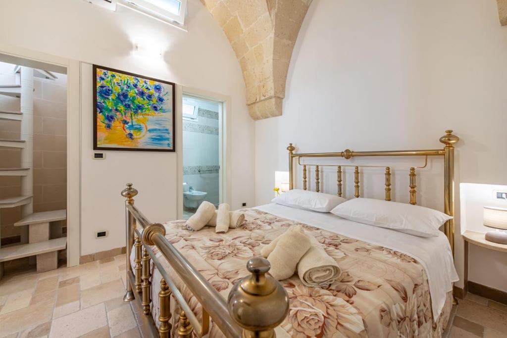 A bed or beds in a room at La Casetta Casa Vacanze