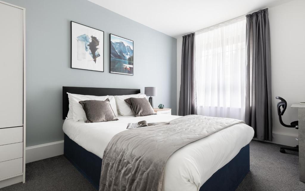 Ένα ή περισσότερα κρεβάτια σε δωμάτιο στο Beautiful Central 4 Bedroom Apart next2 KingsCross
