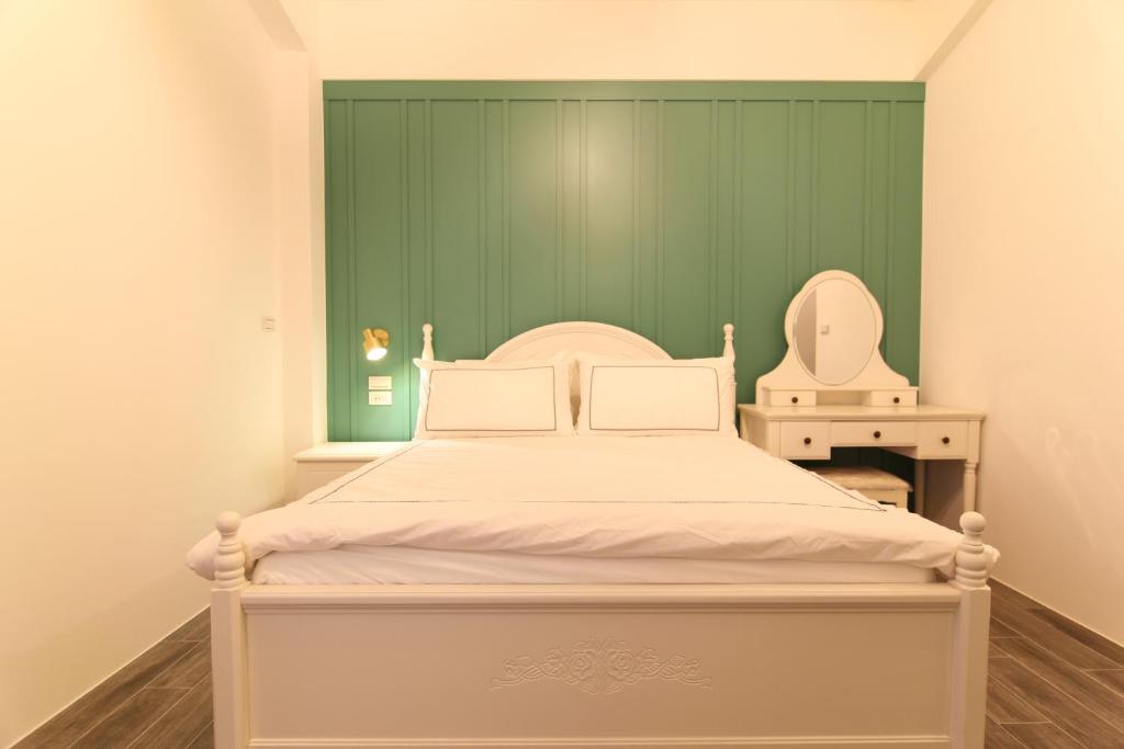 Een bed of bedden in een kamer bij Zhen Guesthouse