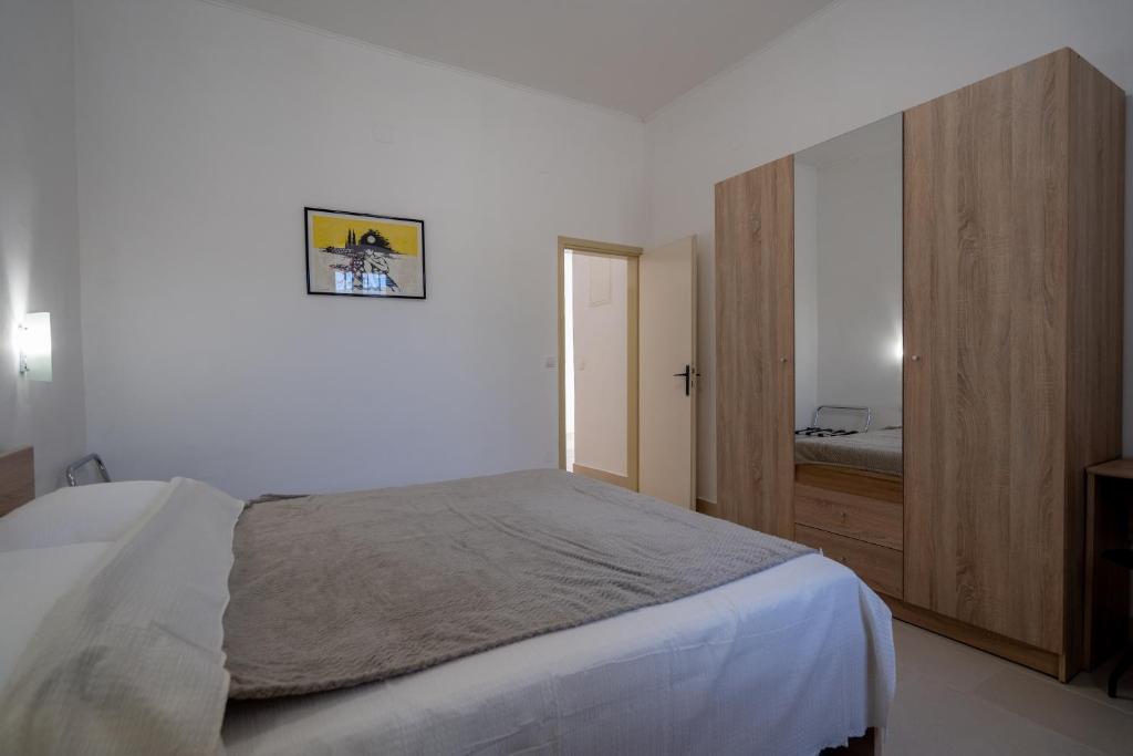 Posteľ alebo postele v izbe v ubytovaní Seafront apartment Marina
