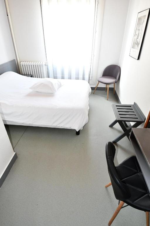 Postel nebo postele na pokoji v ubytování Le Pasteur