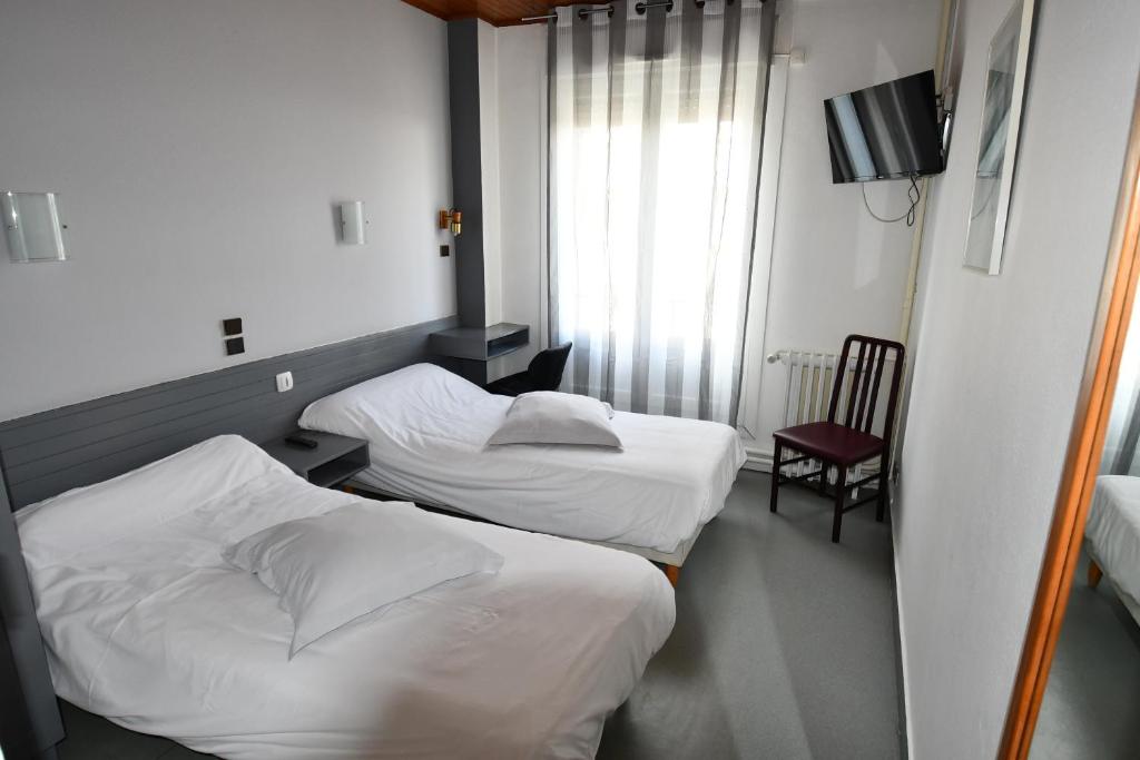 Postel nebo postele na pokoji v ubytování Le Pasteur
