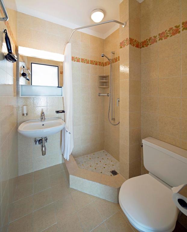 Koupelna v ubytování Hotel Garni Rivabella au Lac