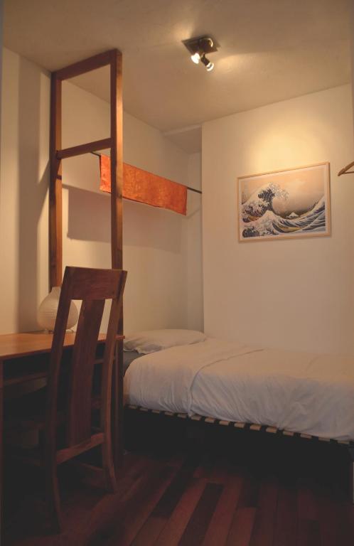 Postel nebo postele na pokoji v ubytování Chambres d'hôtes Les Chatougoulis