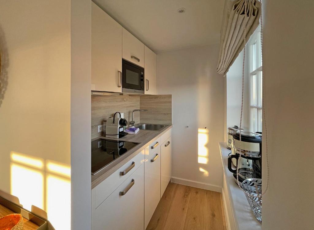 Kuchyň nebo kuchyňský kout v ubytování Ferienwohnung Wattteufel