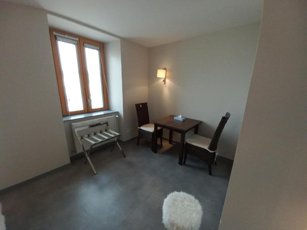 Posezení v ubytování SARL DU PARC Hôtel Les Tremplins