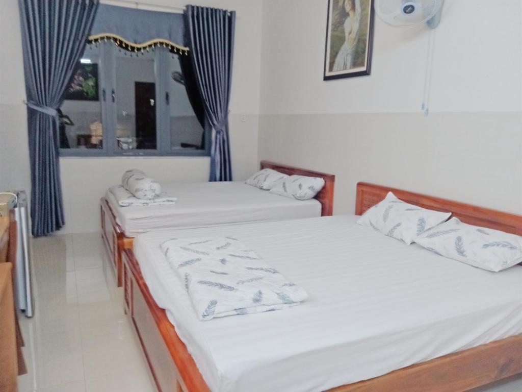 Voodi või voodid majutusasutuse Minh Quân hotel toas