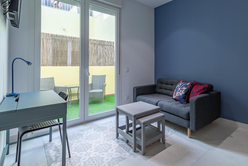 a living room with a couch and a table at Sunny,Private Terrace,Wheelchair access in Valencia