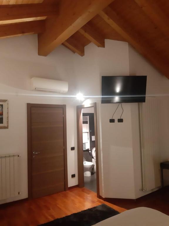 TV a/nebo společenská místnost v ubytování Il giardino di Pietro
