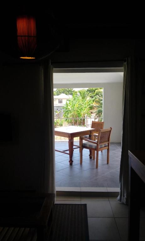 Posezení v ubytování Le Colonial Cocoon Apartement 2